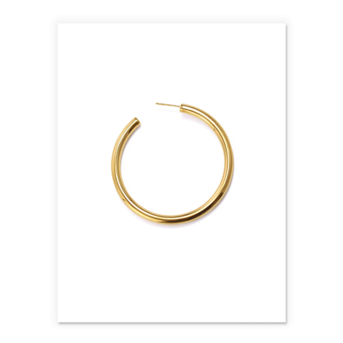 Minimalist brass hoop earrings for women in sleek gold finish, perfect for elevating any outfit.