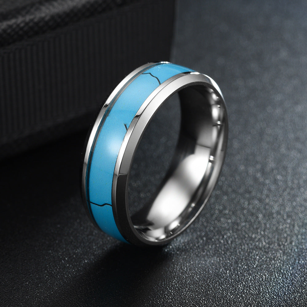 Stainless Steel Turquoise Fashion Rings showcasing a stylish blue inlay and durable design on a textured surface.