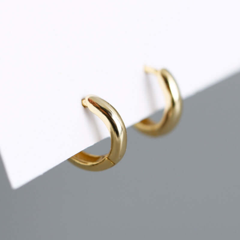 S925 silver round hoop earrings in gold, featuring a sleek and elegant circular design, perfect for any occasion.