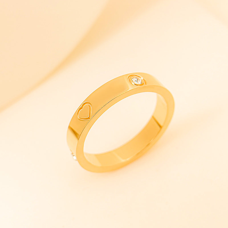 Rhinestone titanium steel bracelet ring in gold with heart design and sparkling gemstone detail.