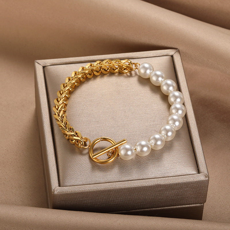 Stainless Steel OT Buckle Bracelet for Women featuring gold links and white pearls in a gift box.