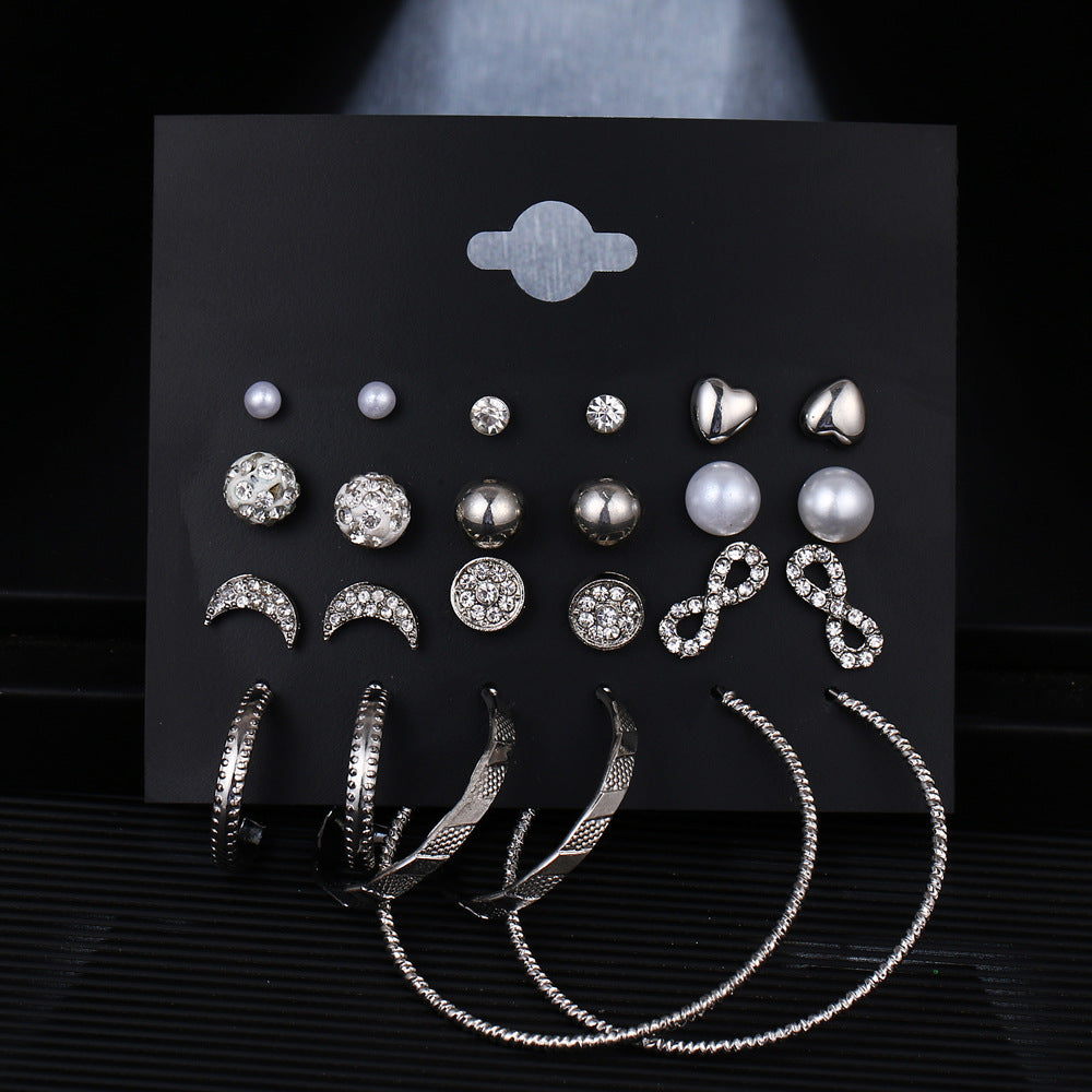 12 pairs of star and moon diamond earrings set featuring silver designs with intricate geometric shapes and sparkling accents.
