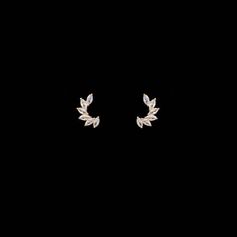 daily wear zirconia stud earrings with a stylish leaf design against a black background.