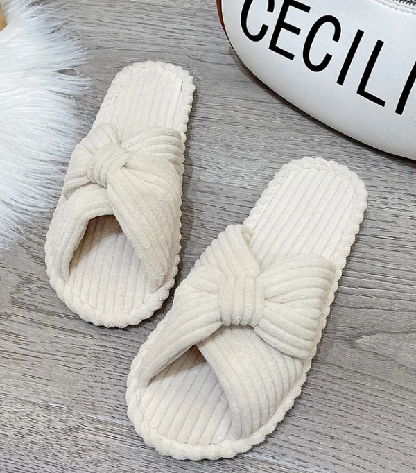 Cute home indoor soft bottom comfortable cotton linen slippers in creamy-white color.