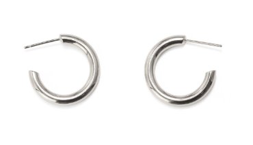 Minimalist brass hoop earrings showcased in sleek silver finish for stylish women.