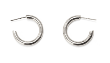 Minimalist brass hoop earrings showcased in sleek silver finish for stylish women.