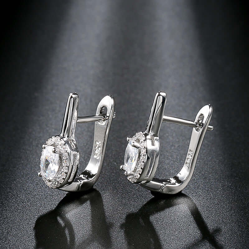 Zirconia circle stud earrings showcasing elegant design with sparkling rhinestones and shiny silver finish.