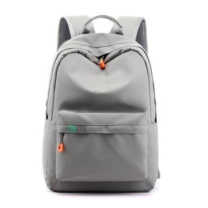 Fashion travel backpack in grey with stylish design, perfect for leisure and business, featuring a spacious front pocket.