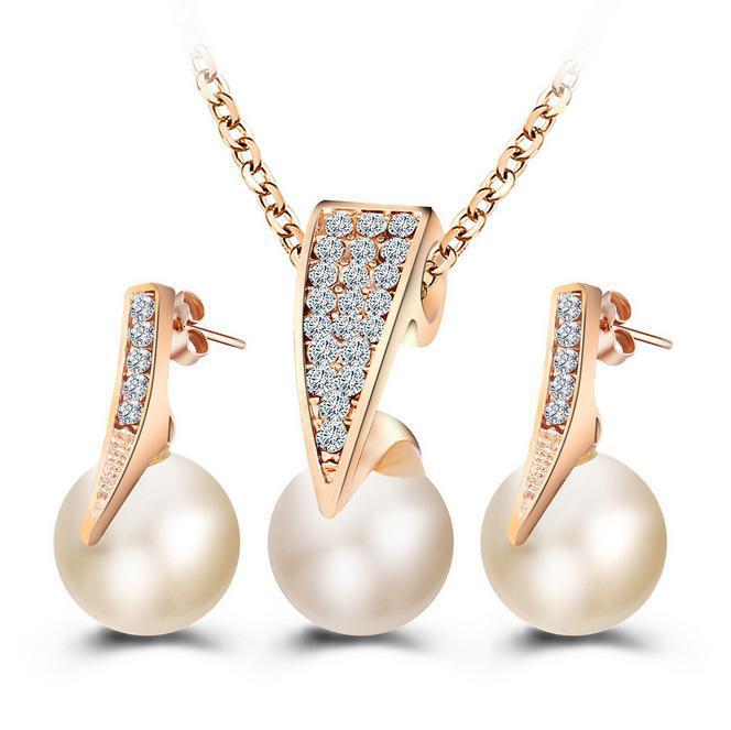 bridal pearl necklace and earrings set featuring diamond-encrusted crystal and freshwater pearls in elegant design.