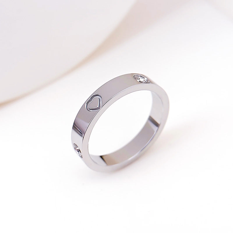 Rhinestone titanium steel bracelet ring featuring a heart design and sparkling rhinestones, in elegant steel color.