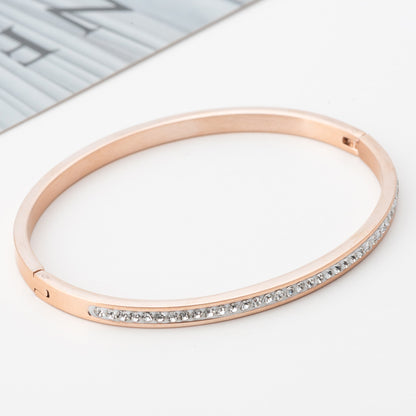 Stainless steel diamond bracelet in rose gold featuring a single row of sparkling diamonds.