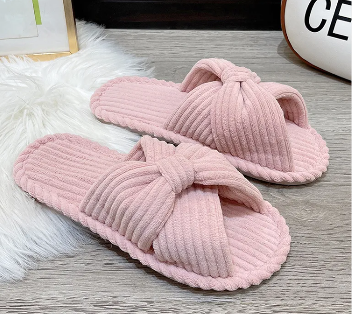 Cute pink open toe comfortable cotton linen slippers with a stylish knot design.