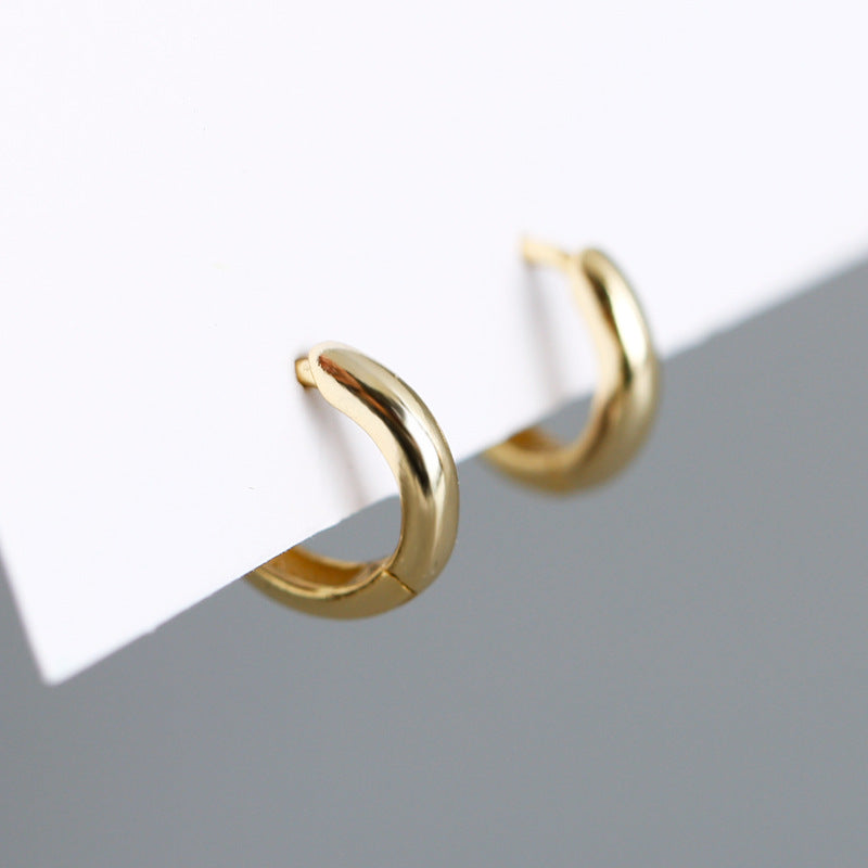 S925 silver round hoop earrings in gold, showcasing a sleek design with a polished finish, perfect for elegant looks.