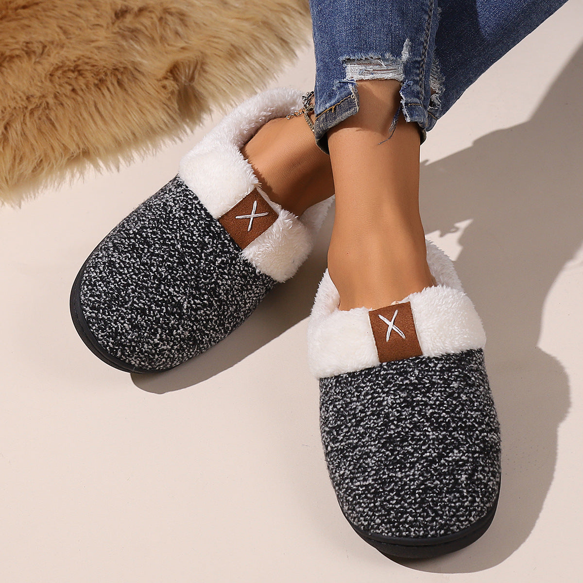 Warm plush slippers for men and women in black and white, featuring a soft, cozy design with a thick bottom.