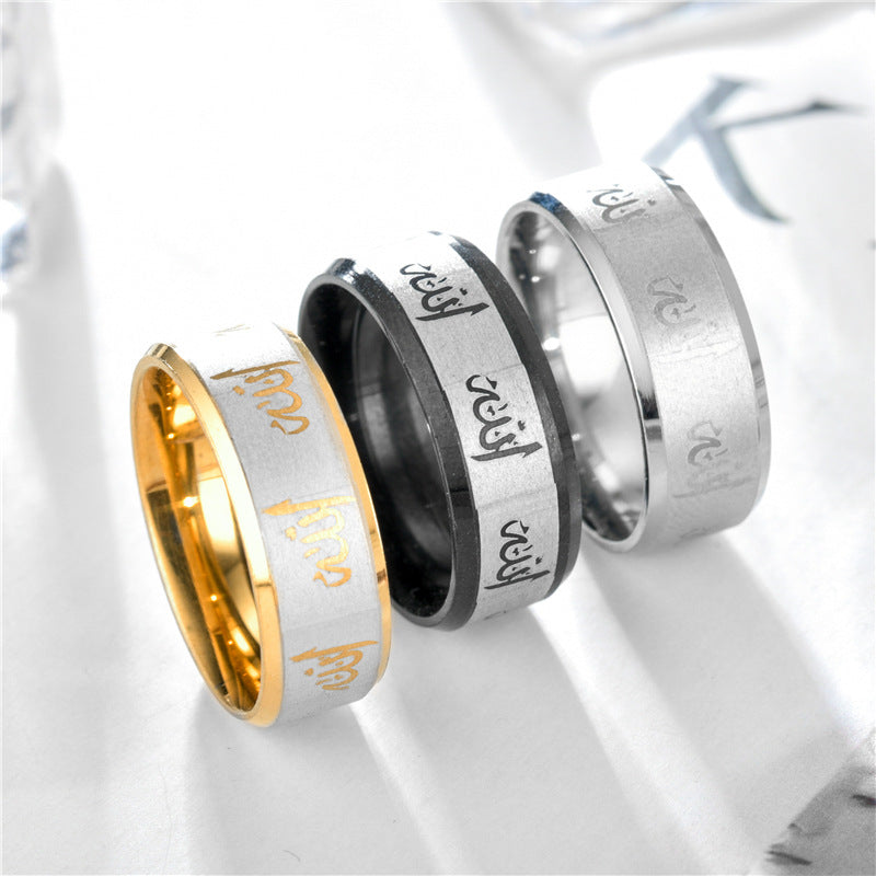 Simple Titanium Steel Couples Ring set in silver, black, and gold displaying English letters.