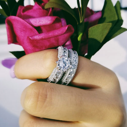 925 sterling silver engagement ring showcased on a hand holding pink roses, perfect for weddings or special occasions.