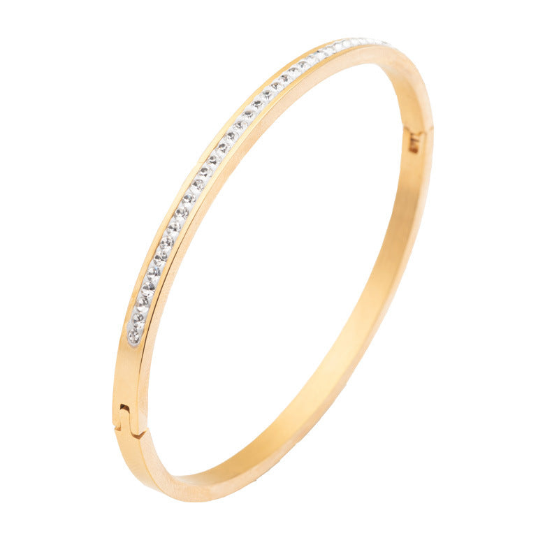 Gold stainless steel diamond bracelet featuring a single row of diamond detail, elegant and durable design.