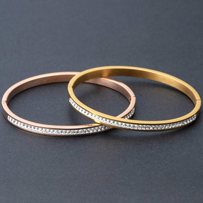 Stainless steel diamond bracelet displayed with rose gold and yellow gold finishes featuring diamond detail.