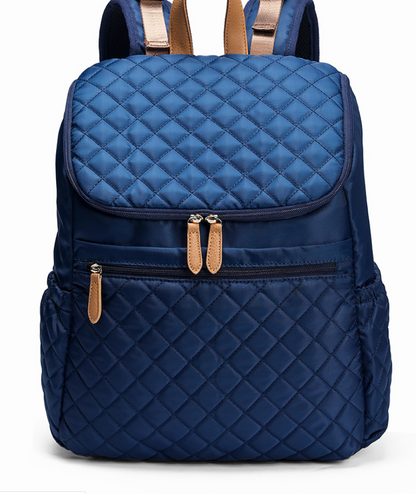 Navy blue large capacity mommy backpack with quilted design and secure zipper closures.