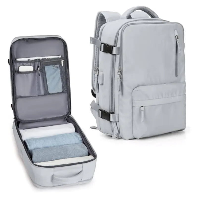 Large capacity travel laptop backpack in silver gray, showcasing spacious multi-compartment design and organized interior.