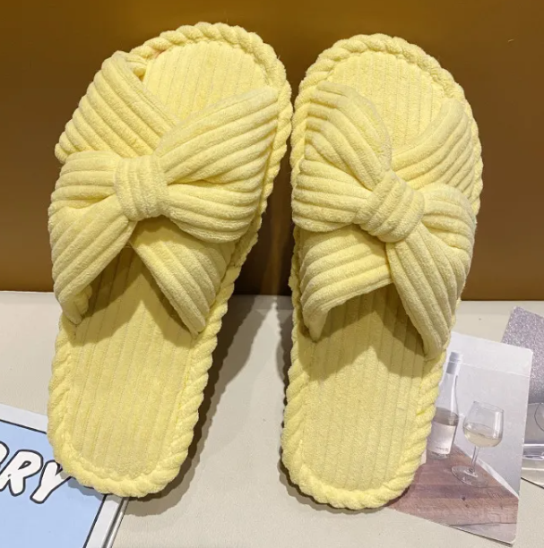 Cute yellow comfortable cotton linen slippers with bow design, perfect for indoor wear.