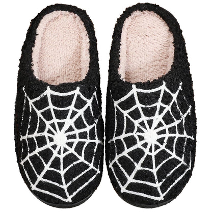 Cozy pumpkin plush slippers in black spider web design, perfect for indoor and outdoor use with soft plush material.