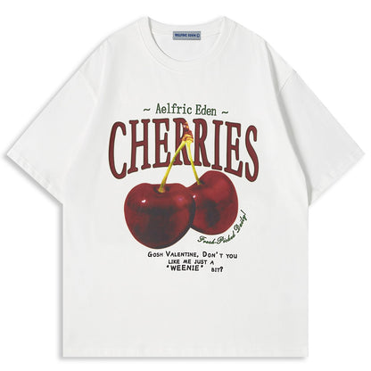 Aelfric Eden cherry print oversized graphic tee in white with a vibrant cherry design and playful text.
