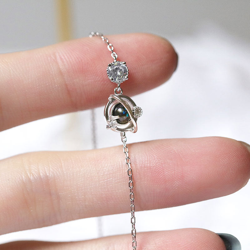 S925 Silver Cosmic Starry Sky Planet Bracelet for Women, showcasing a stunning cosmic design with starry accents.
