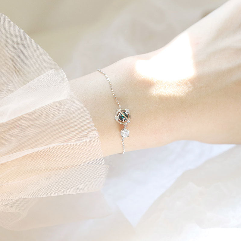 S925 Silver Cosmic Starry Sky Planet Bracelet for Women showcased on a wrist, capturing elegance and individuality.