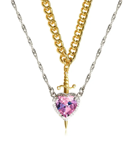 gold heart and sword necklace set featuring a pink crystal heart and sword design on dual-tone chains.
