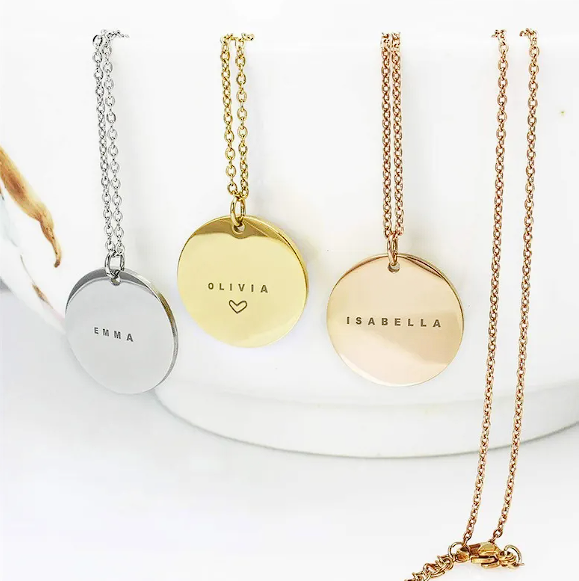 Personalized stainless steel clavicle chain featuring silver, gold, and rose gold discs with names.