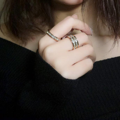 Double row zircon stainless steel ring for women displayed on a hand wearing stylish rings.
