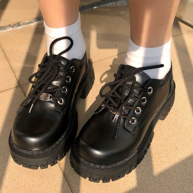 Thick soled leather shoes in black with round toe and lace-up design, perfect for summer outings.