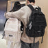 Stylish student backpack for high school seen on two individuals in a modern setting.