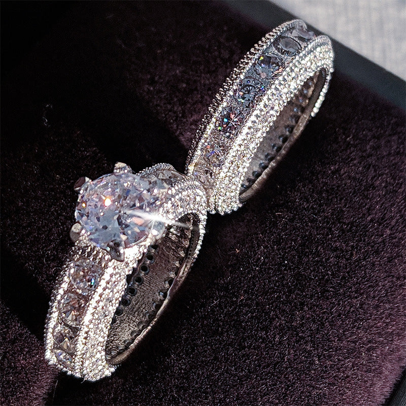 Stunning 925 sterling silver engagement ring featuring a glamorous diamond setting, perfect for special occasions.