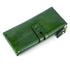 Vintage oil wax leather wallet in a rich green color with a stylish zip and button closure.