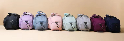 Multi-functional sports bag with wet dry separation in various colors lined up on a table.