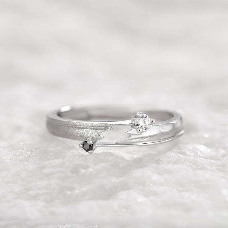 Adjustable sterling silver couple ring featuring a modern geometric design with black and clear stones, perfect for couples.
