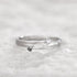 Adjustable sterling silver couple ring featuring a modern geometric design with black and clear stones, perfect for couples.
