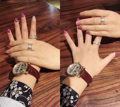 Two hands showcasing a double row zircon stainless steel ring for women, elegant rings and stylish nails.