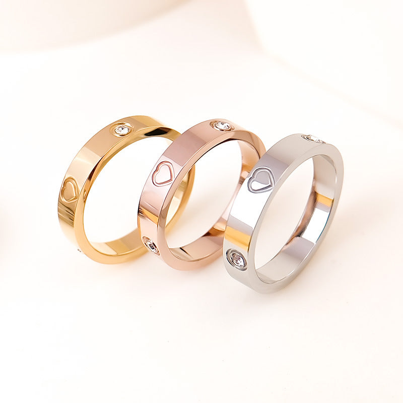 Rhinestone titanium steel bracelet ring set featuring gold, rose gold, and silver bands with heart designs.