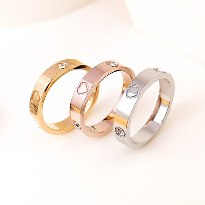 Rhinestone titanium steel bracelet ring set featuring gold, rose gold, and silver bands with heart designs.