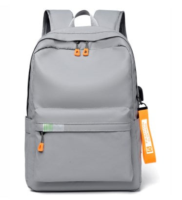 Fashion travel backpack in light grey with multiple pockets and ergonomic straps for comfort.
