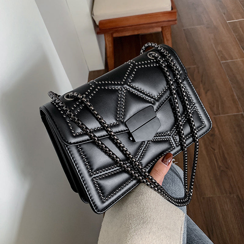 Black chain shoulder messenger bag for women with unique quilted design and stylish chain strap.