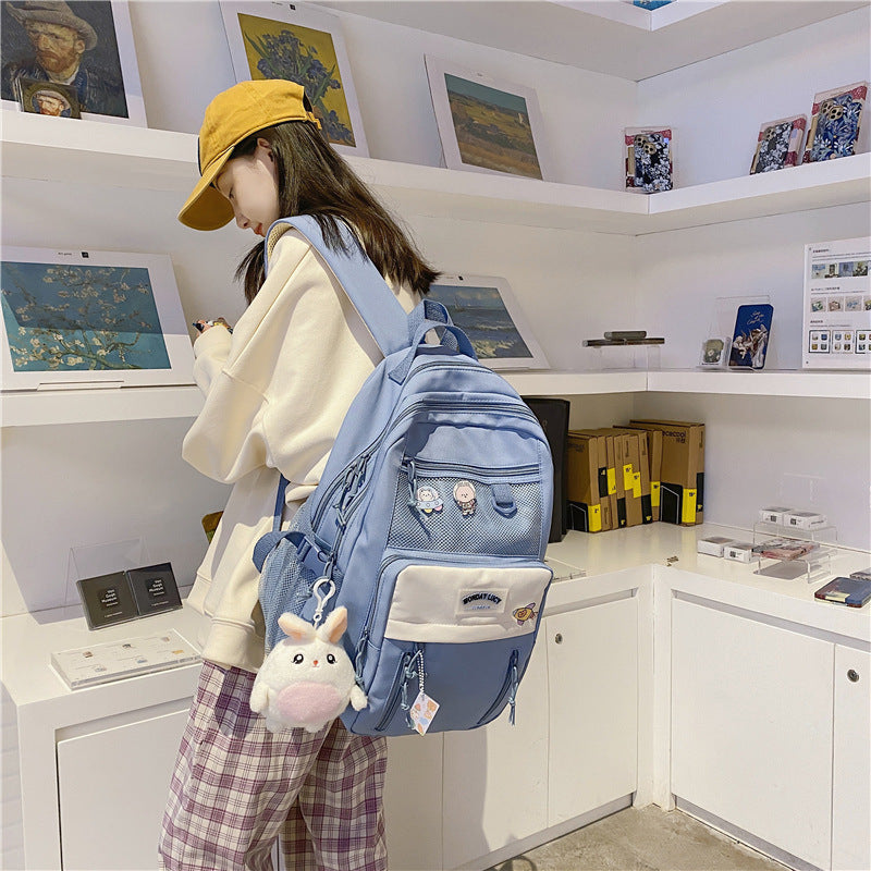 High-capacity backpack for students in stylish blue, perfect for school and carrying essentials.