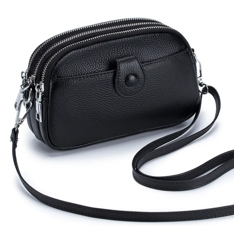 New leather fashion mobile phone bag in black with zippers and shoulder strap.