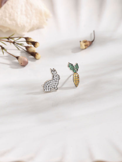 Rabbit and Carrot Silver Earrings featuring sparkling gems on a marble surface, perfect for playful elegance.