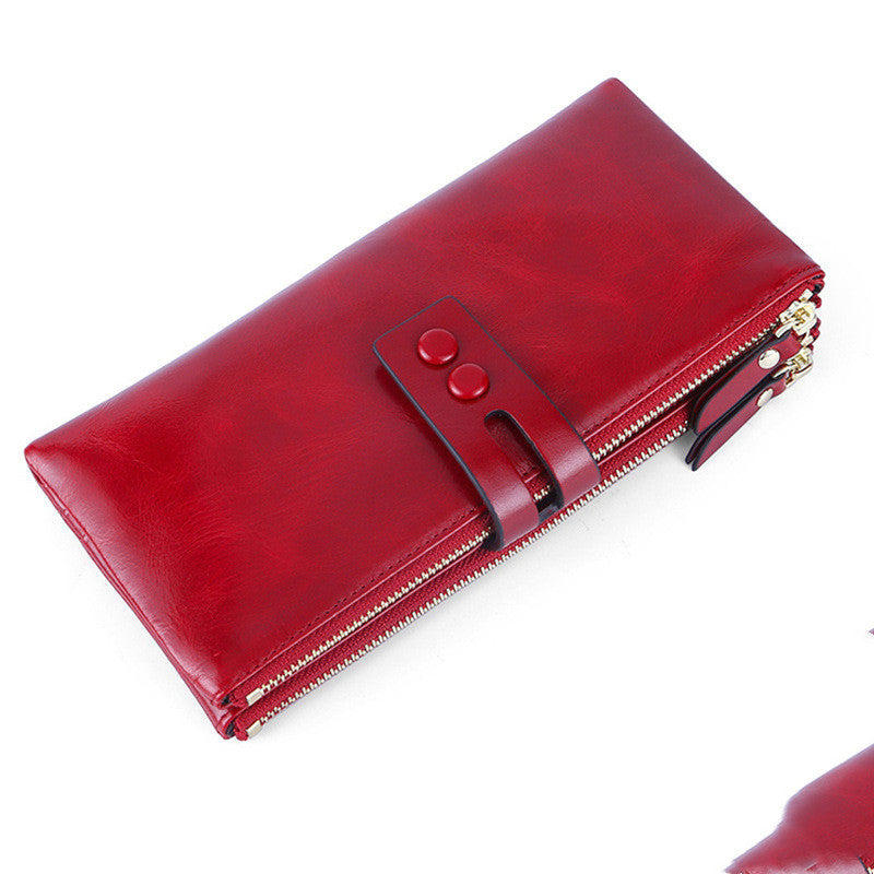 Vintage oil wax leather wallet in wine red with a stylish money clip and zip closure.