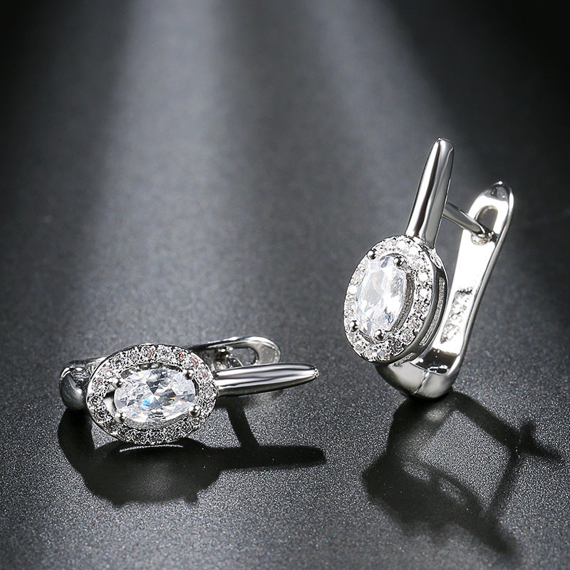 Zirconia circle stud earrings design featuring beautiful gemstones and elegant silver casing.