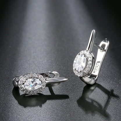 Zirconia circle stud earrings design featuring beautiful gemstones and elegant silver casing.
